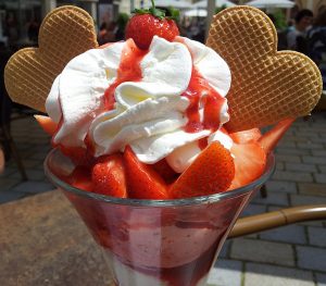 Strawberry ice cream sundae with heart wafers